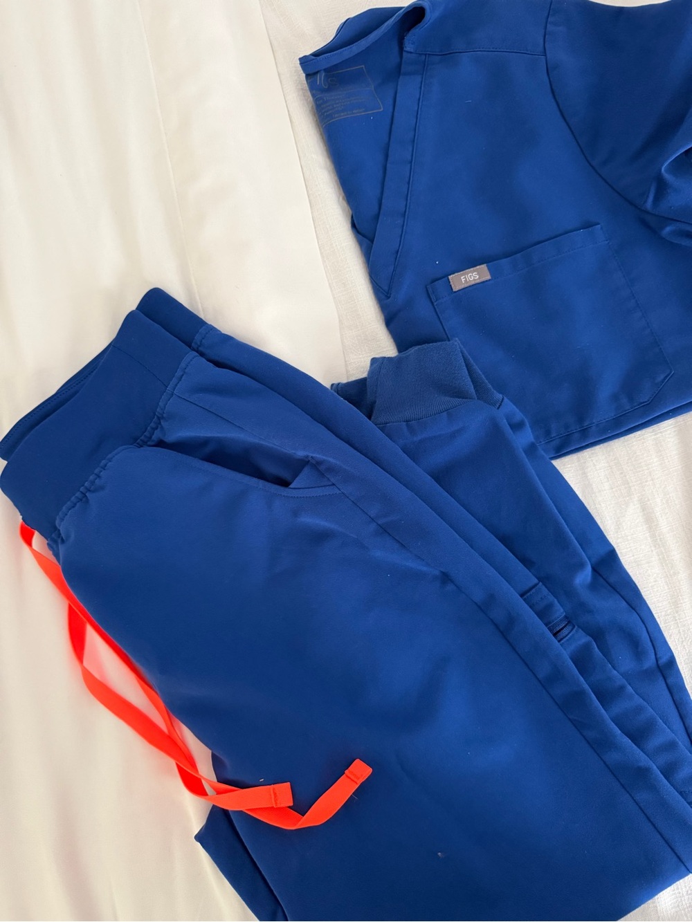Figs Scrubs Woman’s Royal Blue Top and Jogger Pants with Orange Drawstring